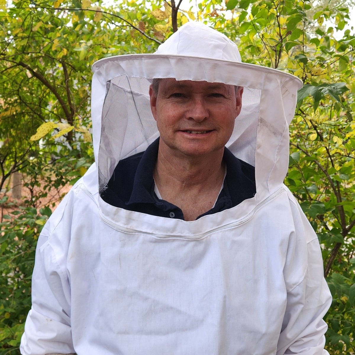 Image of Rick wearing a bee suit.